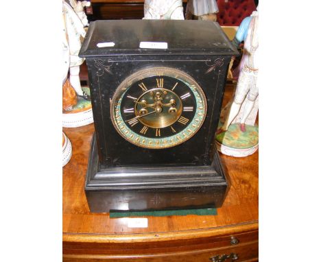 A Victorian slate mantel clock with visible escapement - 34cms high