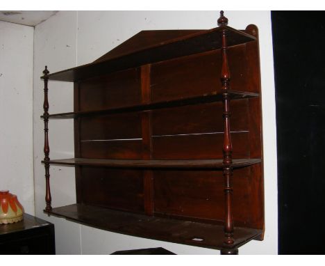 An antique mahogany four shelf wall whatnot