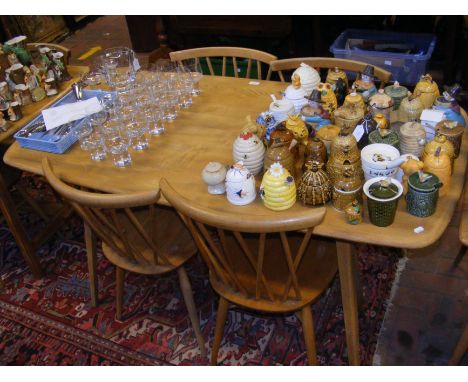 A vintage mid century Blonde Ercol dining table with four Ercol Model 376 Candlestick dining chairs  CONDITION REPORT Damage 