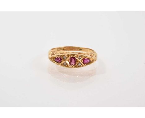 Late Victorian 18ct gold ruby and diamond ring with three oval mixed cut rubies and four rose cut diamonds in 18ct gold setti