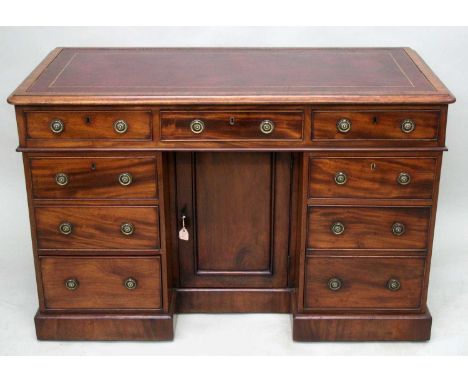 Mid 19th century mahogany desk, of small size, with original tooled leather inset writing surface and nine drawers about the 