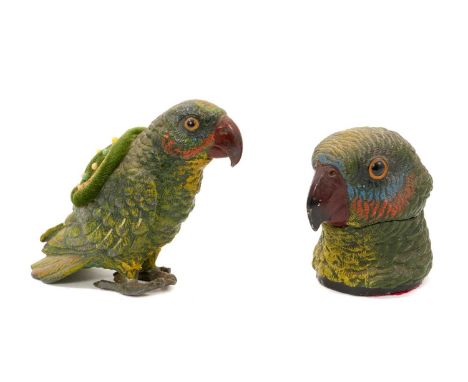 Early 20th century cold-painted metal parrot pin cushion, 10cm high and similar inkwell
