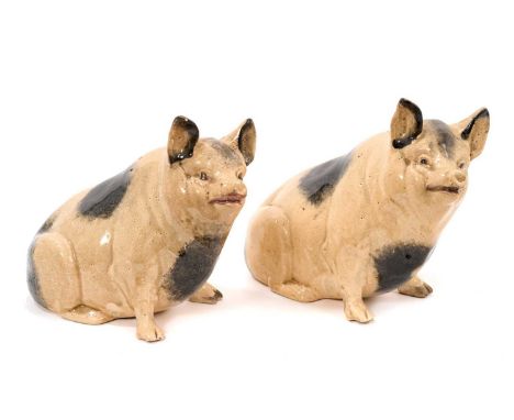 A Scottish ceramic pig money box, early 20th century, marked to base, 15cm high, and a similar pig, 16cm high (2)