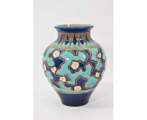 Burmantofts faience vase, decorated with flower heads against a two-tone blue ground, impressed marks, 18cm highSmall footrim