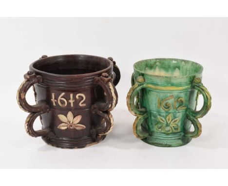 Two Castle Hedingham pottery tygs, both with spurious dates of 1612, marks to bases, 17cm and 17.5cm high