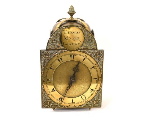 19th century Turkish market lantern clock by Thomas Moore, London together with a later wall bracket. The arched dial signed,