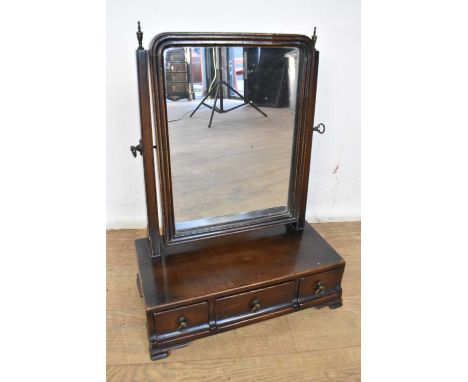 George III mahogany swing frame toilet mirror, of small size, with original arched silvered plate, the base with three drawer