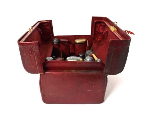 Late 19th/early 20th century, Mappin &amp; Webb red leather vanity case (with key), containing a large selection glass toilet