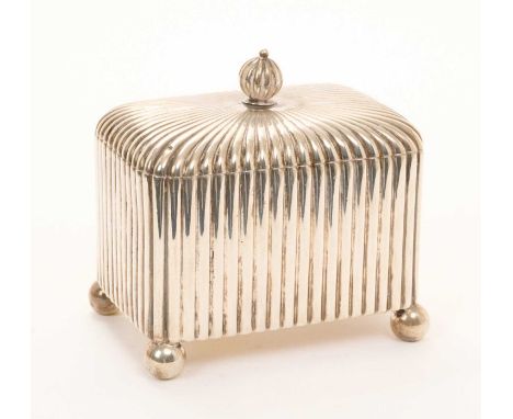 Early 20th century German silver tea caddy of rectangular form, with fluted decoration and hinged cover, on four ball feet, u