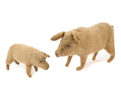 Antique Steiff pig, with blue glass eyes and button to the ear, 39cm long, together with a Steiff piglet. (2)