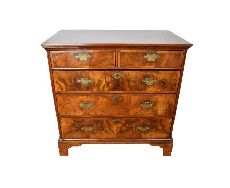 Early 18th century walnut crossbanded chest of drawers, having possibly later figured veneering to the top and two short over