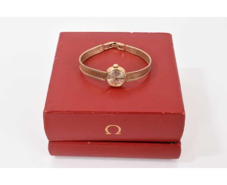 1960s ladies Omega 9ct gold wristwatch with manual wind movement in circular gold 17mm case on integral 9ct gold bracelet, in