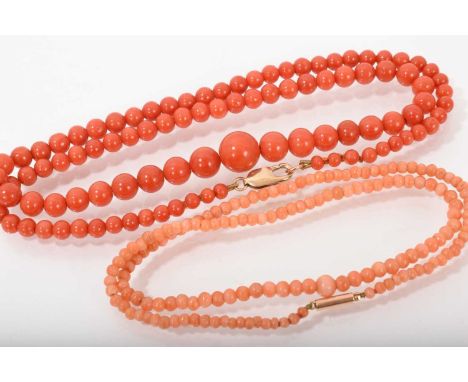 Two coral bead necklaces, each with a string of graduated beads and 9ct gold claspsThe darker coral bead necklace graduates f