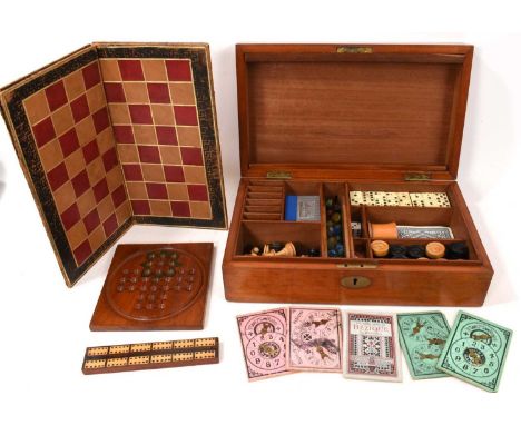 Edwardian mahogany games compendium with fitted interior comprising draughts, chess, backgammon, solitaire, dominoes, bezique