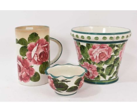 Three pieces of Wemyss pottery decorated with roses, including a jardinière, large tankard and small vase (3)
