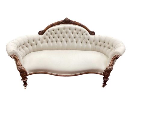 Good quality Victorian carved walnut framed sofa, the arched back, with carved cresting, upholstered on buttoned cream materi