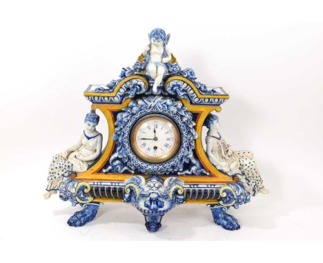 Late 19th century French faience pottery cased mantel clock, the movement signed 'Jno. Gaydon, Barnstable' the case with orna