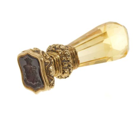19th century gold mounted seal, the intaglio carved garnet with armorial crest and faceted citrine handle, 38mmVery good cond