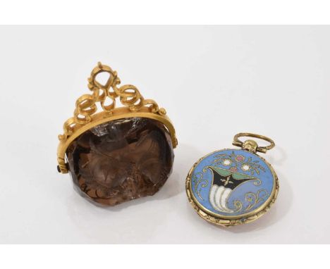 Regency gilt metal enamel locket decorated with a cornucopia vase of flowers on blue ground and a glazed compartment to the r