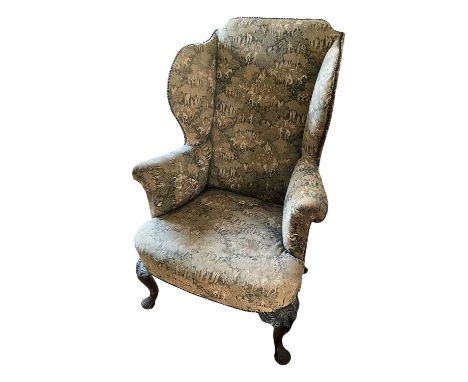 George I style wing armchair, with mediaeval tapestry themed upholstery. raised on shell carved walnut cabriole legs and pad 