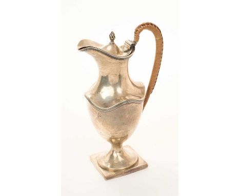 Early George V Neoclassical revival silver ewer of small proportions, in the George III style, with hinged cover and rattan c