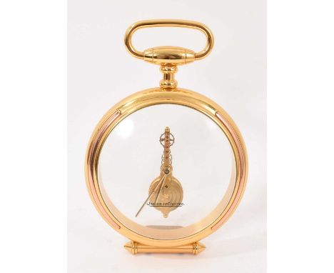Jaeger-LeCoultre 'Mystery' desk clock of enlarged pocket watch form with signed glass and movement, gilt brass case with inte