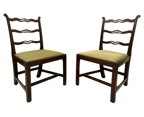 Pair of George III mahogany side chairs, eared uprights rails with pierced waved ladder back, drop-in seats upholstered in gr