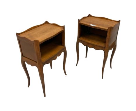 Pair of early 20th century mahogany bedside tables, rectangular top with shaped three-quarter raised edge, fitted with recess