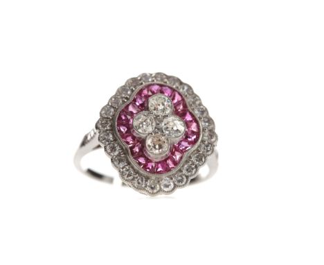 RUBY, SPINEL AND DIAMOND RING, set with four Old European cut diamonds bordered by calibre cut rubies and spinels totalling a