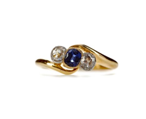 SAPPHIRE AND DIAMOND RING, set with a cushion shaped sapphire of approximately 0.36 carats flanked by two Old Mine cut diamon