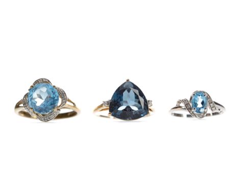 THREE BLUE GEM SET RINGS, comprising a round blue gem set and diamond ring, in nine carat gold, size S 1/2, and a trillion cu