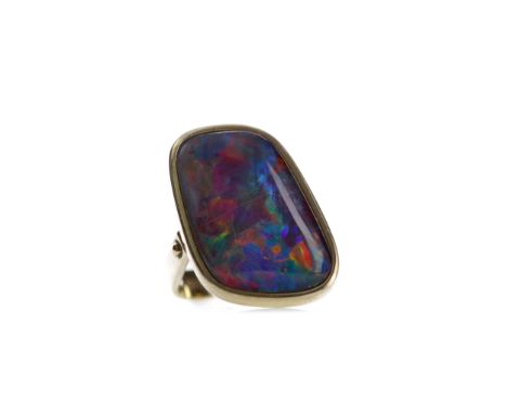 OPAL TRIPLET RING, of irregular form, 24mm long, marked 585, size J 1/2, 10.4g