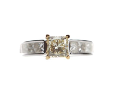 YELLOW DIAMOND RING, set with a princess cut yellow diamond of approximately 1.50 carats, with colourless diamonds to each sh