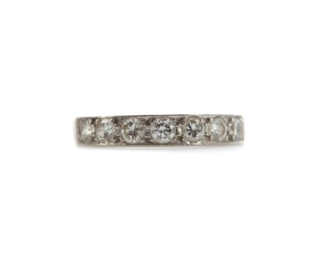 DIAMOND HALF HOOP ETERNITY RING, set with a row of seven round brilliant cut stones, in eighteen carat white gold