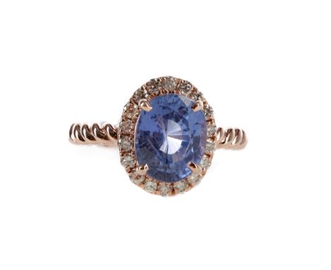 SAPPHIRE AND DIAMOND RING, set with an oval sapphire of approximately 3.98 carats, with evidence of heat treatment, with acco