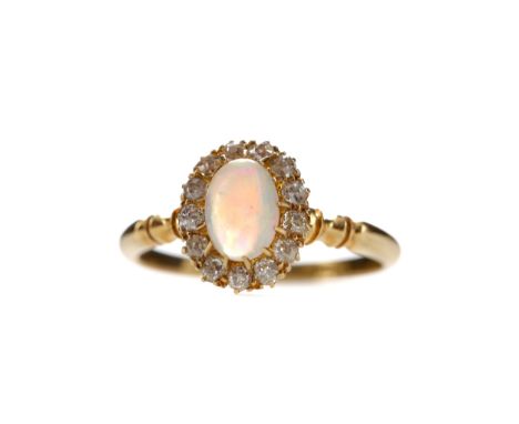 OPAL AND DIAMOND RING, set with an oval cabochon opal within a halo of Old Mine cut diamonds totalling approximately 0.20 car