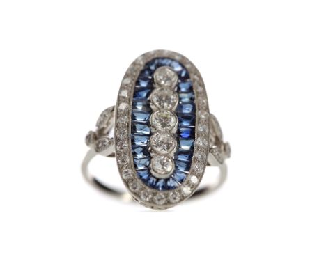 SAPPHIRE AND DIAMOND RING, set with five Old European cut diamonds bordered by calibre cut sapphires totalling approximately 