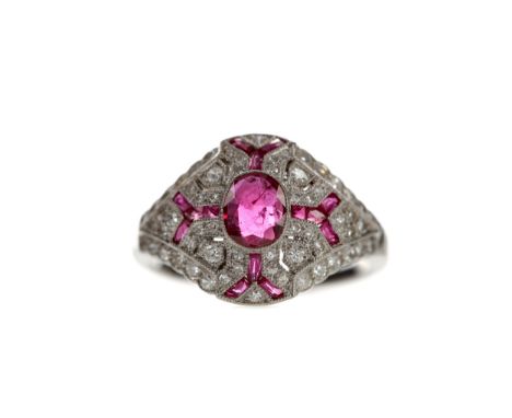 RUBY, SPINEL AND DIAMOND RING, set with a central oval ruby with round brilliant cut diamond, ruby and spinel accents, unmark
