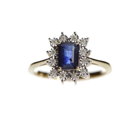 SAPPHIRE AND DIAMOND RING, set with an emerald cut sapphire of approximately 0.88 carats within a halo of illusion set diamon