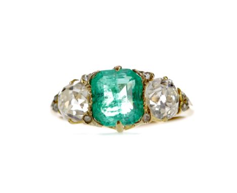 EMERALD AND DIAMOND RING, set with an octagonal step cut emerald of approximately 1.71 carats flanked by two Old Mine cut dia