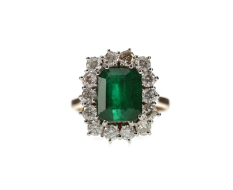 EMERALD AND DIAMOND RING, set with an emerald cut emerald of approximately 3.69 carats, within a halo of round brilliant cut 