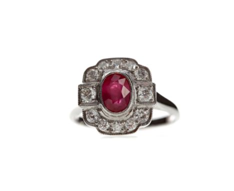 RUBY AND DIAMOND RING, set with an oval ruby of approximately 1.11 carats, surrounded by round brilliant cut diamonds totalli