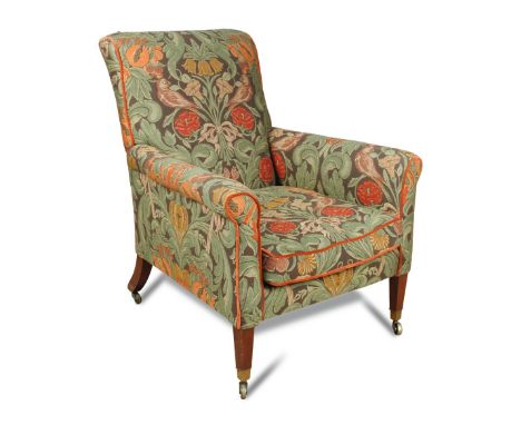 A 19th century mahogany wing back armchair, upholstered in a tapestry fabric with a loose cushion seat, on square tapering le