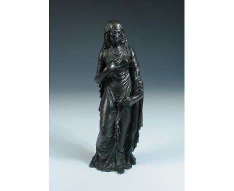 A bronze figure of a vestal virgin, possibly 19th century French, the loosely draped lady stands with right hand to her chest