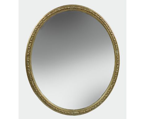 A 19th century gilt framed oval wall mirror, leaf and ovolo moulded decoration 107 x 92cm (42 x 36in)  There is a slight faul