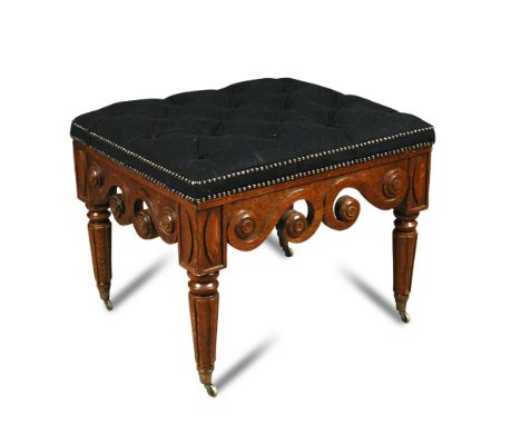 A 19th century oak framed button upholstered stool, upholstered in a black felt fabric, scroll carved show wood and on turned