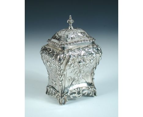 A George III silver tea caddy, by Henry Bailey, London 1768, of bombe shape, all over foliate and floral embossed with applie