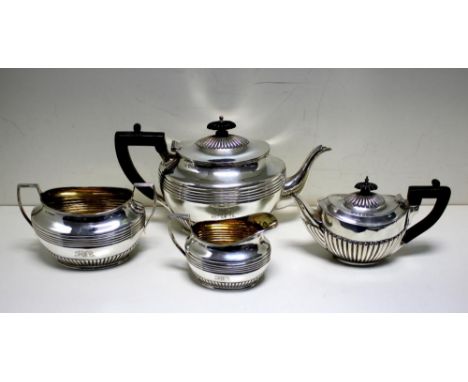 A Victorian silver three piece tea set, by Henry Stratford, Sheffield 1894, comprising:- A teapot of oval form, the lower bod