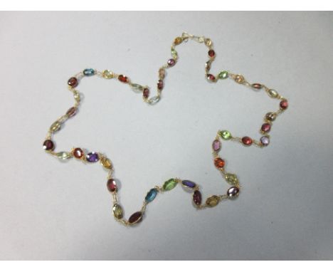 A multi-gemset chain necklace, spectacle set all along with graduated oval and round cut stones, including garnet, amethyst, 