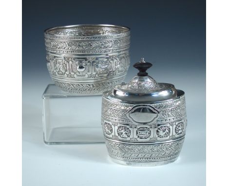 A late Victorian silver tea caddy, by David & George Edward, Glasgow 1892, of oval barrel shape repousse and chase decorated 